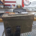 Rustic ammunition box on a counter.