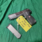 Pistol and magazine with yellow identification tag
