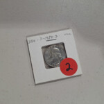 1954 quarter in cardboard coin holder