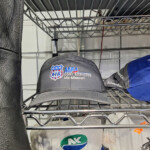 Gray MFA Agri Services baseball cap on shelf