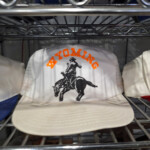 White Wyoming hat with bucking horse logo