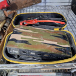Camouflage portable jump starter with cables