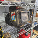 Black welding helmet with Key West sticker