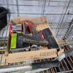 Cardboard box with staple gun and fasteners