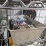 Metal pan with packaged wax melts on shelf