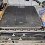 Black Lark digital bathroom scale on shelf