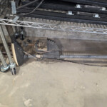 Circular saw blade under wire metal shelving