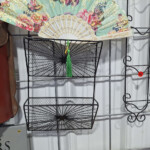 Black wire wall basket organizer with decorative fan