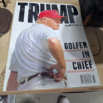 Magazine cover: man in red cap holding ball