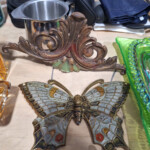 Ornate brass butterfly ornament on table