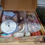 Box of assorted sewing ribbons and trims
