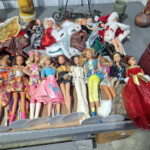 Assorted vintage fashion dolls in colorful outfits