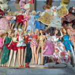 Collection of vintage fashion dolls in colorful outfits