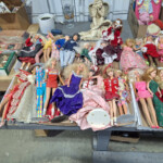 Assorted vintage dolls displayed on table