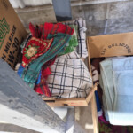 Folded towels and colorful kitchen cloths