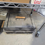 Dusty portable charcoal grill with wooden handles