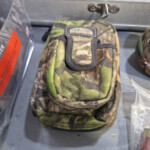 Camouflage fabric utility pouch on table
