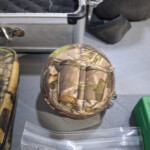 Round camouflage zippered pouch on table