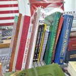 Assorted books standing on display shelf
