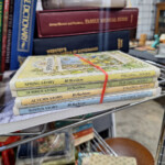 Stack of seasonal children's books with red band