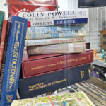 Stack of reference books and encyclopedias