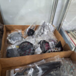 Box of packaged hair accessories on shelf