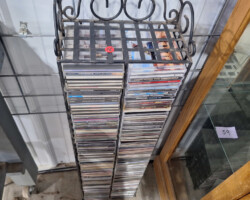 Tall decorative metal rack filled with CDs