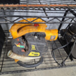 Yellow Poulan Pro handheld leaf blower