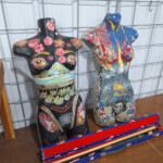 Two painted female torso sculptures