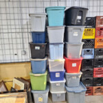 Stacked plastic storage bins and crates
